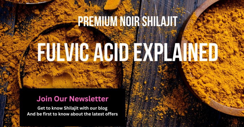 Two bowls with yellow poders in them and the powder also spilled across the woodon table.