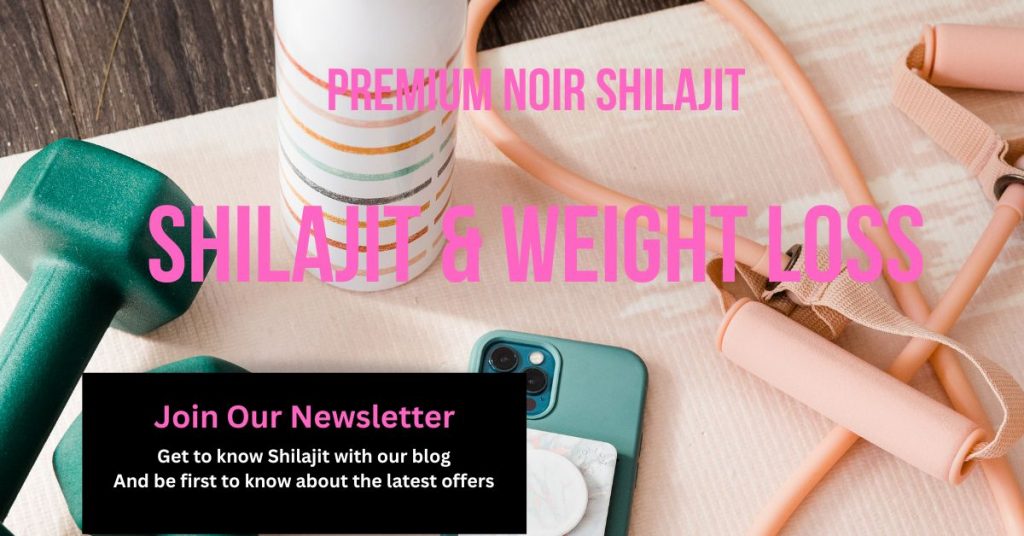 Table with small bar bell, stretch band, water bottle and a mobile phone. Text reads Shilajit and Weight Loss